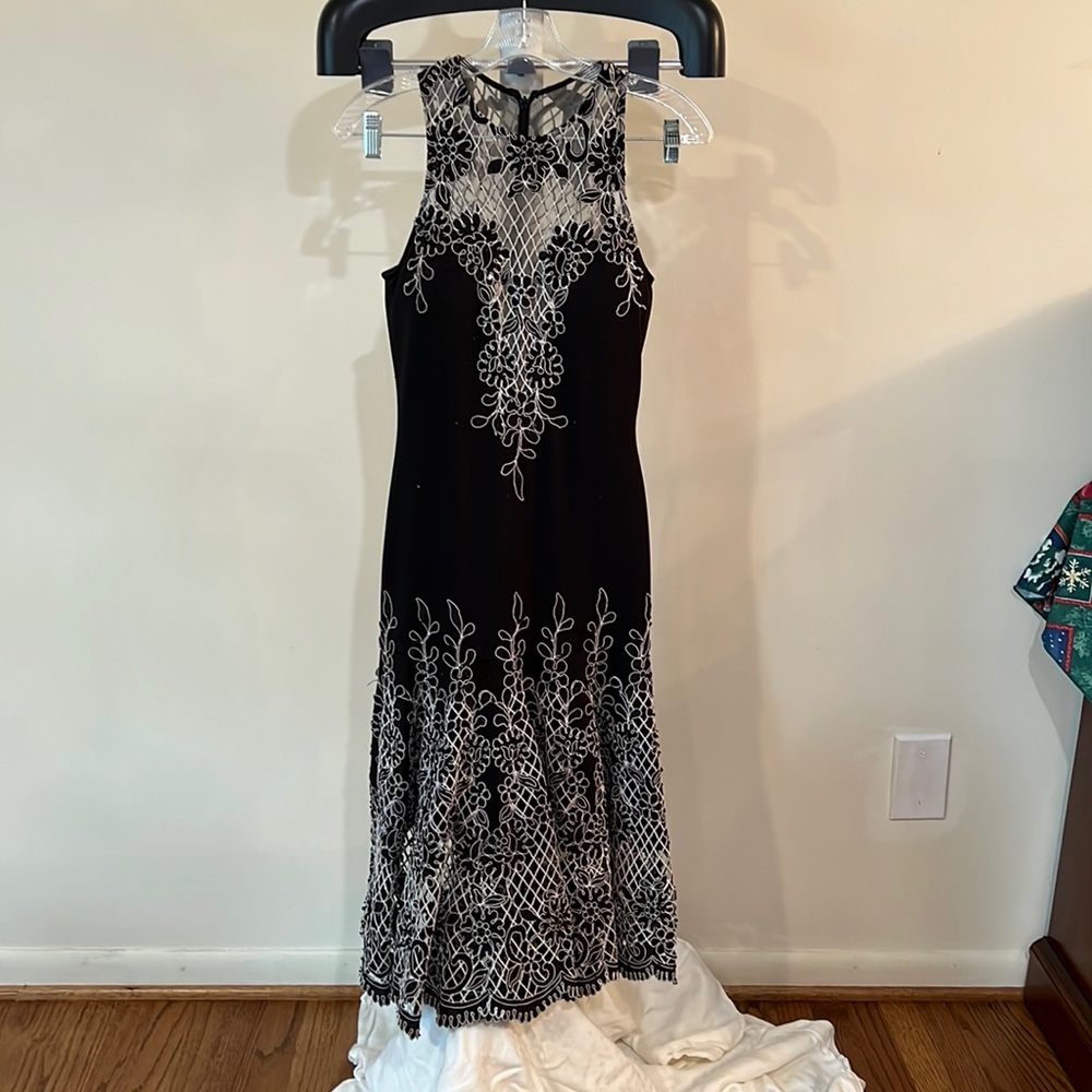 Form fitted size 2.  Details are beautiful see through bottom. Black liner.